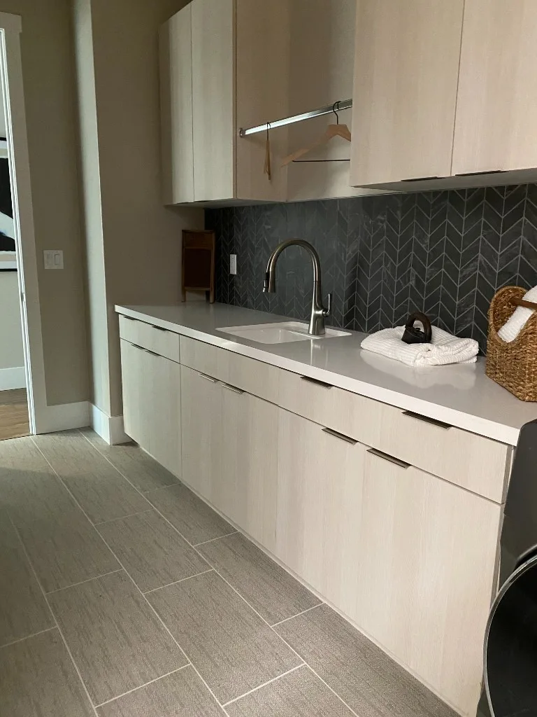 Laundry room chevron backsplash and floor tile